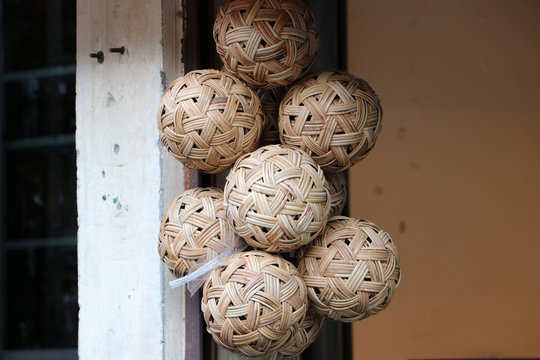 Rattan ball hanging in a bunch. In Myanmar called “chinlone” and in Thailand called “Takraw”.