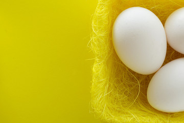 White eggs in bird nest , Easter holiday decorations , Easter concept background. Eggs hunt.