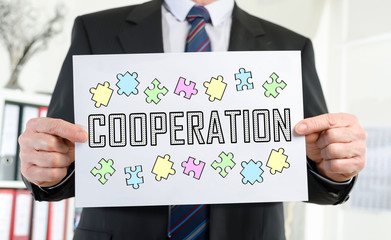 Cooperation concept shown by a businessman