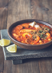 Portion of spanish fish and chorizo soup