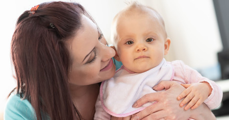 Portrait of mother with her cute baby girl