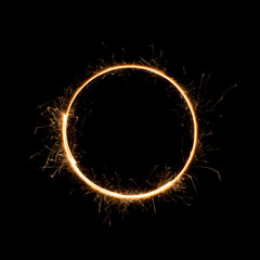 Small sparkler circle. Burning bengal fire round letter o number zero, isolated on black.