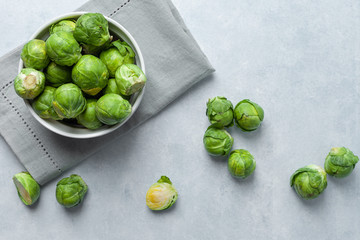 Fresh Brussels sprouts on a light gray concrete background
