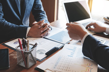 Investment and cooperate concept, business financial inspector analyzing about parformance data in...