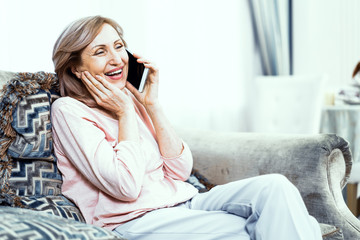Beautiful middle aged woman talking over phone