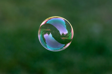 Close up of flying soap bubble