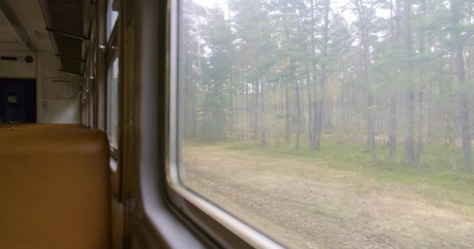 Scenery going past an old soviet trains window 