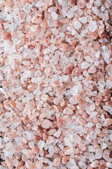 Pink Himalayan salt background top view. 