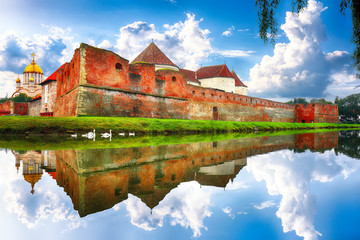 Naklejka na ściany i meble Spring green blossom landscape with Fagaras Fortress, Transylvania.