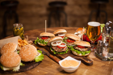 Lots of delicious burgers lying on a table