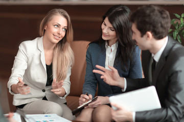 business woman talking to her business team