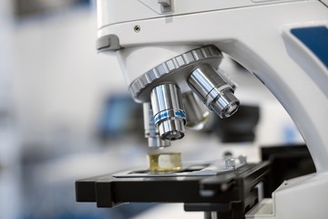 White microscope close-up photo inside laboratory