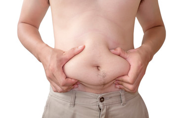 Young man shows fat belly on white background and clipping path.
