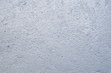 Rough relief plaster painted in silver on wall