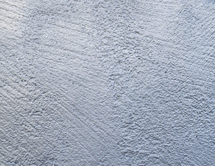 Rough relief plaster painted in silver on wall
