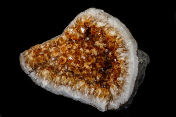 Macro mineral stone Citrine on a black background