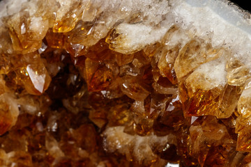 Macro mineral stone Citrine on a black background