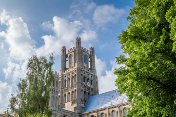 View of the Ely Cathedral against a blue sky with partial clouds, Cambridgeshire, Norfolk, UK