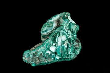 Macro of a mineral stone Malachite on a black background