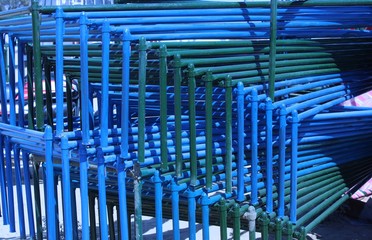 abstract view of blue and green wrought iron beds placed in the shop