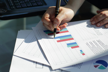 close up. business woman checks financial schedule