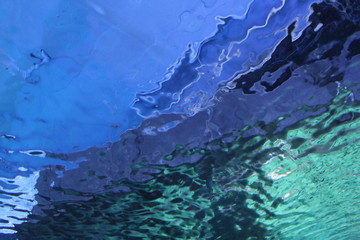 Fototapeta na wymiar blue abstract background/the reflection of the water in the aquarium