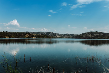 blue lake with cloudy sky, nature series
