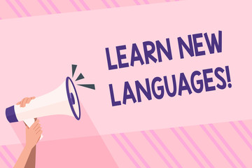 Text sign showing Learn New Languages. Business photo text developing ability to communicate in foreign lang Human Hand Holding Tightly a Megaphone with Sound Icon and Blank Text Space
