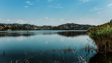 blue lake with cloudy sky, nature series
