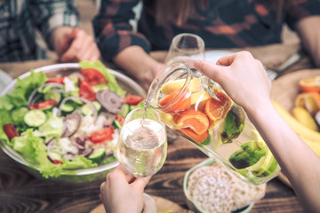 lunch at the table, pour summer drinks