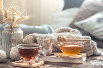 Still life details of home interior on a wooden table with a Cup of tea