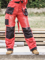 Obraz premium Person wearing red worker trousers