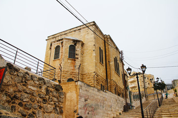 Fototapeta na wymiar Jerusalem, Israel - 4/12/2015: St. Lazarus Church, the Tomb of Lazarus, located in the West Bank town of al-Eizariya, Bethany, near Jerusalem, Israel