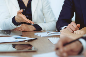 Group of business people or lawyers  at meeting, hands close-up