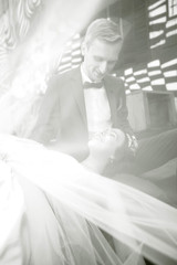 Fototapeta na wymiar black and white background image of a happy newlywed couple