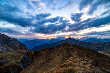 Beautiful sunset shot of majestic Dolomites mountains in Italian Alps. Landscape shot of high rocky mountains in the the Italian Dolomites during Autumn time.