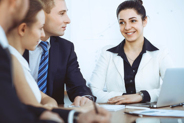 Fototapeta premium Group of business people and lawyers discussing contract papers at meeting