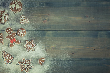 Obraz na płótnie Canvas Christmas gingerbread made of flour on grey table. shortbread cookies for Christmas