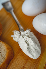 eggs and flour on wooden table