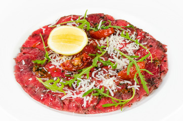 Carpaccio on a plate on a white background