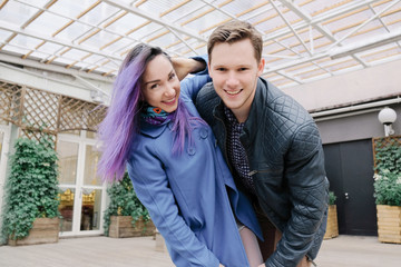 A couple in an embrace in the street.