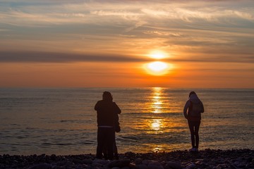 couple on the beach at sunset - 257634446