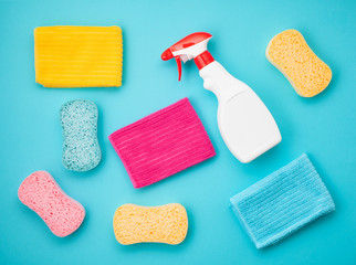 Detergents and cleaning accessories in pastel color.