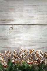 Christmas gingerbread on a light wooden table. A Symbol Of Christmas. Festive food. Delicious cookies and gingerbread. The gingerbread man. Table decoration for the holiday.