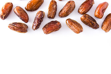 Dates isolated on white background. Top view. Copyspace.