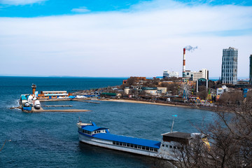 Vladivostok, Russia - 24 March, 2019: View of the city embankment and amusement park