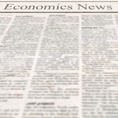 Obraz premium Newspaper with headline Economics News and old unreadable text