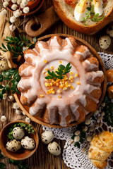 Easter yeast cake with icing and candied orange peel, delicious Easter dessert, top view. Traditional Easter pastries in Poland