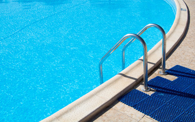 Fototapeta na wymiar Outdoor swimming pool with blue clean Water