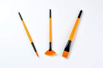 Set of paint brushes on white background